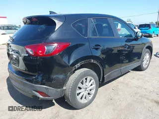 2016 Mazda CX-5 Touring z VIN JM3KE4CY2G0656270, wystawiony jako IAAI lot #42344489 z przebiegiem 60 449 mil mil oraz . Historia ofert i sprzedaży dostępna na DreamBid. Obrazek 4.