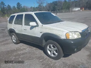 2005 Mazda Tribute S with VIN 4F2YZ06155KM32376, listed as a IAAI auction lot 41584730 with 291,444 mi miles and . Bid and sale history available at carsss.com. Image 1.