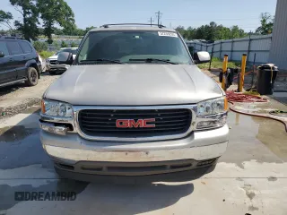 2005 GMC Yukon SLE z VIN 1GKEC13T75J179930, wystawiony jako Copart lot #57259205 z przebiegiem 310 454 mil mil oraz Szkody całkowita. Historia ofert i sprzedaży dostępna na DreamBid. Obrazek 5.