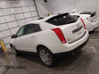 2012 Cadillac SRX Premium Collection z VIN 3GYFNFE38CS591123, wystawiony jako IAAI lot #41827636 z przebiegiem 143 867 mil mil oraz . Historia ofert i sprzedaży dostępna na DreamBid. Obrazek 15.