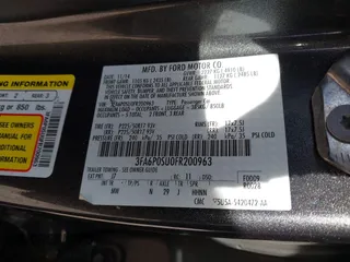 2015 Ford Fusion Energi Titanium with VIN 3FA6P0SU0FR200963, listed as a IAAI auction lot 41897182 with 104,100 mi miles. Bid and sale history available at carsss.com. Image 9.