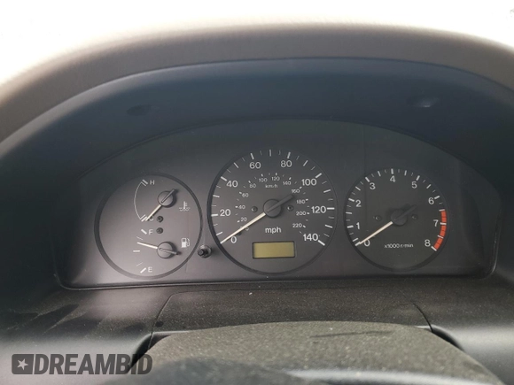 1997 Mazda Protege DX z VIN JM1BC1414V0103244, wystawiony jako Copart lot #56219745 z przebiegiem Nie podano mil oraz Szkoda całkowita • Salvage title. Historia ofert i sprzedaży dostępna na DreamBid. Obrazek 9.