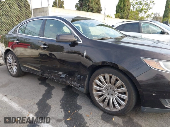2013 Lincoln MKS with VIN 1LNHL9DK6DG608673, listed as a IAAI auction lot 42756289 with 103,118 mi miles and . Bid and sale history available at DreamBid. Image 6.