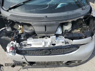 2015 Smart fortwo Passion z VIN WMEEJ3BA8FK811537, wystawiony jako Copart lot #57823255 z przebiegiem Nie podano mil oraz Szkoda całkowita • Salvage title. Historia ofert i sprzedaży dostępna na DreamBid. Obrazek 11.