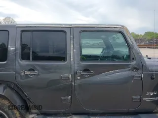 2017 Jeep Wrangler Unlimited Sahara with VIN 1C4BJWEGXHL595724, listed as a IAAI auction lot 42018264 with 95,948 mi miles. Bid and sale history available at carsss.com. Image 6.