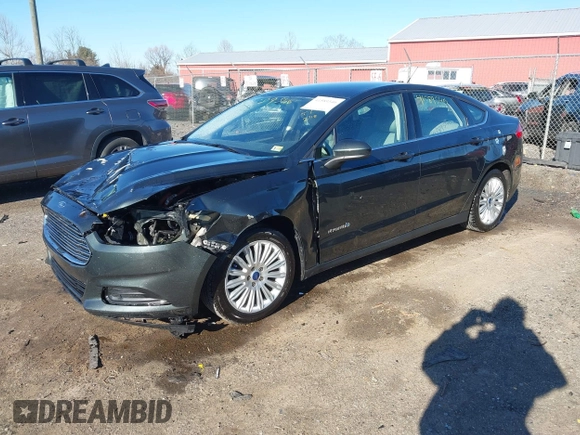 2015 Ford Fusion S Hybrid with VIN 3FA6P0UU7FR117785, listed as a IAAI auction lot 41589546 with 136,657 mi miles. Bid and sale history available at carsss.com. Image 2.