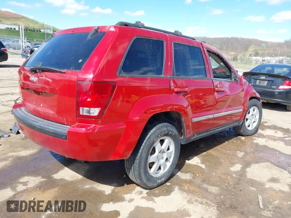 2010 Jeep Grand Cherokee Laredo with VIN 1J4PR4GK9AC143199, listed as a IAAI auction lot 41972153 with 81,896 mi miles. Bid and sale history available at carsss.com. Image 4.