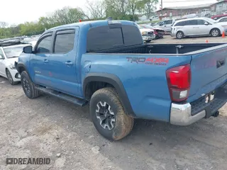 2019 Toyota Tacoma 4WD SR with VIN 3TMCZ5AN0KM260201, listed as a IAAI auction lot 42017048 with 49,216 mi miles. Bid and sale history available at carsss.com. Image 3.