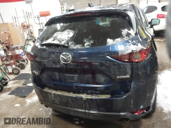 2020 Mazda CX-5 Touring z VIN JM3KFBCM9L0843045, wystawiony jako IAAI lot #41361008 z przebiegiem 76 107 mil mil oraz . Historia ofert i sprzedaży dostępna na DreamBid. Obrazek 16.
