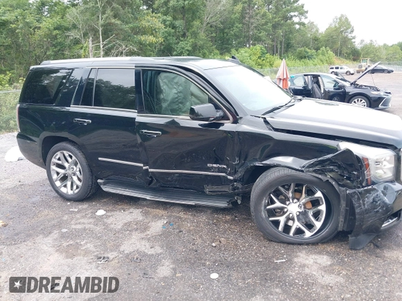 2016 GMC Yukon Denali with VIN 1GKS1CKJXGR254306, listed as a IAAI auction lot 39953539 with 164,149 mi miles. Bid and sale history available at carsss.com. Image 6.