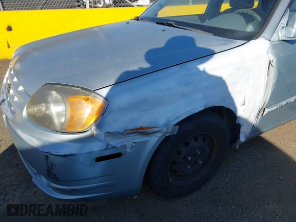 2004 Hyundai Accent GL with VIN KMHCG45C14U547954, listed as a IAAI auction lot 41350219 with 138,436 mi miles. Bid and sale history available at carsss.com. Image 11.