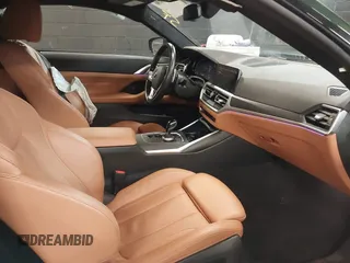 2022 BMW 4 Series 430i xDrive with VIN WBA73AP04NCK88044, listed as a IAAI auction lot 41577730 with 28,907 mi miles and . Bid and sale history available at DreamBid. Image 5.