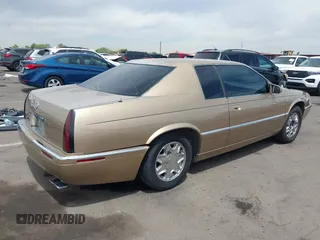 1999 Cadillac Eldorado ESC z VIN 1G6EL12Y5XU603764, wystawiony jako IAAI lot #42368692 z przebiegiem 154 613 mil mil oraz . Historia ofert i sprzedaży dostępna na DreamBid. Obrazek 4.