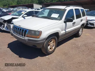 2002 Jeep Grand Cherokee Laredo with VIN 1J4GX48S32C134911, listed as a IAAI auction lot 42323138 with 156,852 mi miles and . Bid and sale history available at DreamBid. Image 2.