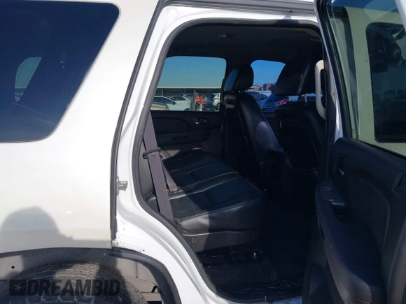 2012 Chevrolet Tahoe Commercial with VIN 1GNLC2E0XCR185593, listed as a IAAI auction lot 41217784 with 150,419 mi miles and . Bid and sale history available at DreamBid. Image 8.