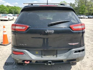 2014 Jeep Cherokee Trailhawk with VIN 1C4PJMBS1EW242527, listed as a Copart auction lot 53160485 with 104,074 mi miles and Salvage Title. Bid and sale history available at carsss.com. Image 6.
