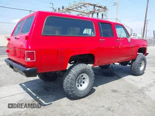 1991 GMC Suburban z VIN 1GKGR26N7MF513031, wystawiony jako IAAI lot #42179575 z przebiegiem 68 871 mil mil oraz . Historia ofert i sprzedaży dostępna na DreamBid. Obrazek 4.