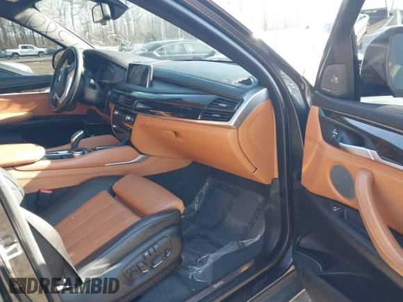 2019 BMW X6 xDrive35i z VIN 5UXKU2C51K0Z64589, wystawiony jako IAAI lot #41537380 z przebiegiem 60 769 mil mil oraz . Historia ofert i sprzedaży dostępna na DreamBid. Obrazek 5.