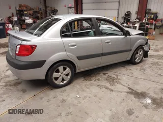 2009 Kia Rio LX with VIN KNADE223596444133, listed as a IAAI auction lot 41598865 with Not Provided miles and . Bid and sale history available at DreamBid. Image 13.