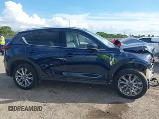 2021 Mazda CX-5 Grand Touring with VIN JM3KFADM0M0469886, listed as a IAAI auction lot 41617270 with 33,571 mi miles. Bid and sale history available at carsss.com. Image 14.