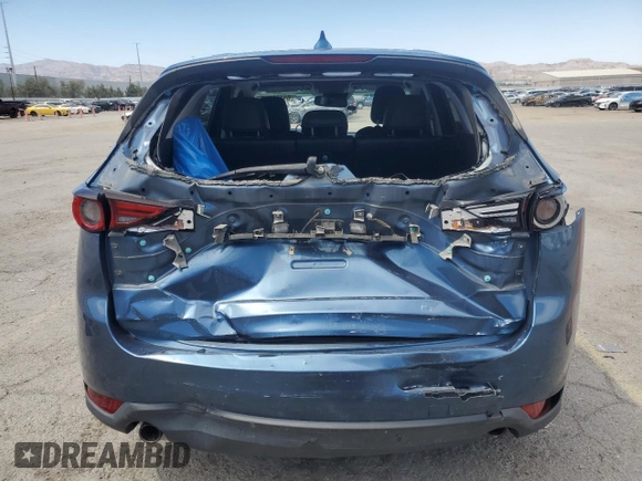 2018 Mazda CX-5 Grand Touring with VIN JM3KFBDM3J0323211, listed as a Copart auction lot 61166735 with Not provided miles and Salvage title. Bid and sale history available at DreamBid. Image 6.