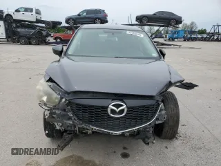 2014 Mazda CX-5 Touring z VIN JM3KE4CY2E0368729, wystawiony jako Copart lot #55563645 z przebiegiem 204 521 mil mil oraz Szkoda całkowita • Salvage title. Historia ofert i sprzedaży dostępna na DreamBid. Obrazek 5.