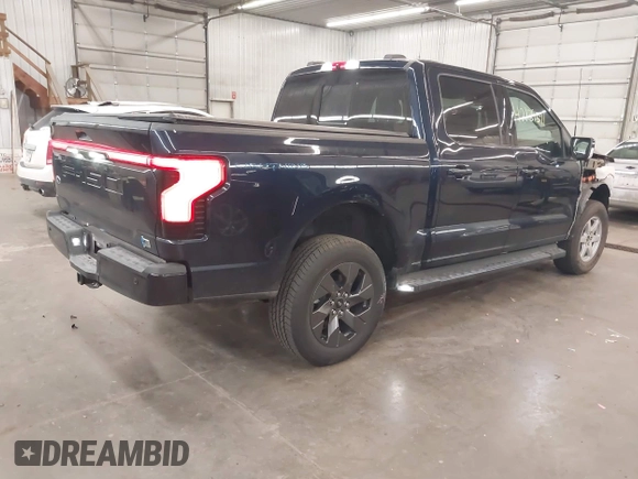 2023 Ford F-150 Lightning Pro with VIN 1FTVW1EL4PWG22900, listed as a IAAI auction lot 42139391 with 6,569 mi miles and . Bid and sale history available at DreamBid. Image 4.