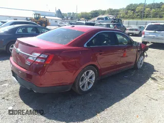 2014 Ford Taurus SEL with VIN 1FAHP2E87EG139913, listed as a IAAI auction lot 40216089 with 95,336 mi miles and . Bid and sale history available at carsss.com. Image 4.