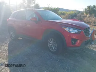 2016 Mazda CX-5 Touring with VIN JM3KE2CY5G0911093, listed as a IAAI auction lot 41807284 with 140,210 mi miles. Bid and sale history available at carsss.com. Image 1.