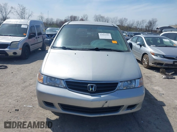 2002 Honda Odyssey LX z VIN 2HKRL18532H567409, wystawiony jako IAAI lot #42069502 z przebiegiem 173 662 mil mil oraz . Historia ofert i sprzedaży dostępna na DreamBid. Obrazek 13.