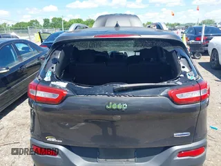 2014 Jeep Cherokee Latitude with VIN 1C4PJLCS0EW297415, listed as a IAAI auction lot 42198645 with 160,268 mi miles. Bid and sale history available at carsss.com. Image 6.