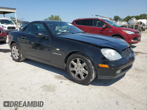 1999 Mercedes-Benz SLK-Class with VIN WDBKK47F5XF129037, listed as a Copart auction lot 68842504 with 74,397 mi miles and Salvage Title. Bid and sale history available at carsss.com. Image 4.