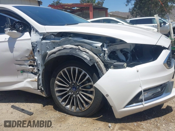 2017 Ford Fusion Titanium z VIN 3FA6P0SU0HR329224, wystawiony jako IAAI lot #42291605 z przebiegiem 176 728 mil mil oraz . Historia ofert i sprzedaży dostępna na DreamBid. Obrazek 18.