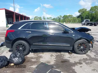 2018 Cadillac XT5 FWD with VIN 1GYKNARS2JZ160862, listed as a IAAI auction lot 42584234 with 152,785 mi miles and . Bid and sale history available at DreamBid. Image 14.