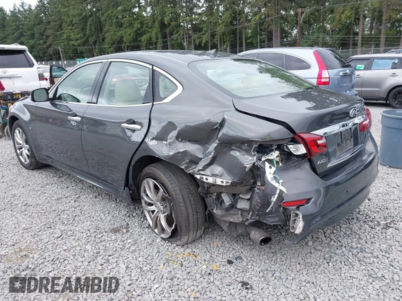 2015 Infiniti Q70 with VIN JN1BY1ARXFM562111, listed as a IAAI auction lot 42473521 with 123,212 mi miles and . Bid and sale history available at DreamBid. Image 3.