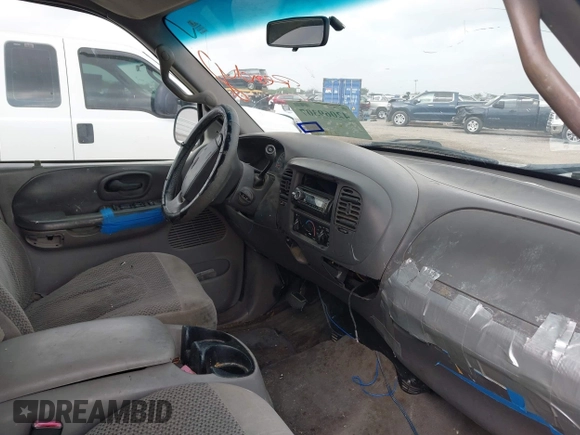 2002 Ford F-150 XLT with VIN 1FTRW07602KB74836, listed as a IAAI auction lot 42069307 with 295,692 mi miles. Bid and sale history available at carsss.com. Image 5.