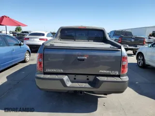 2011 Honda Ridgeline RTL with VIN 5FPYK1F58BB452957, listed as a Copart auction lot 63214204 with 223,311 mi miles and Salvage Title. Bid and sale history available at carsss.com. Image 6.