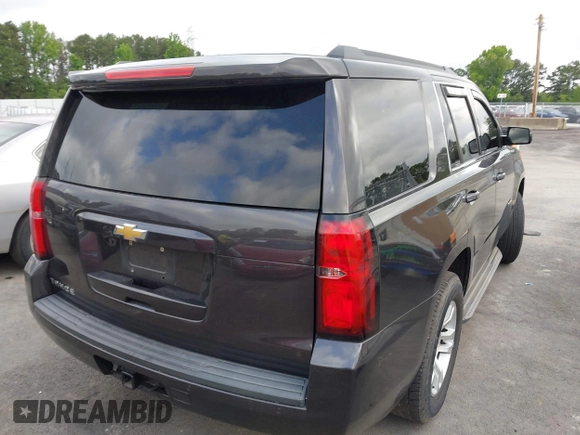 2015 Chevrolet Tahoe LS with VIN 1GNSCAKC0FR245826, listed as a IAAI auction lot 42282590 with 164,208 mi miles and . Bid and sale history available at DreamBid. Image 4.