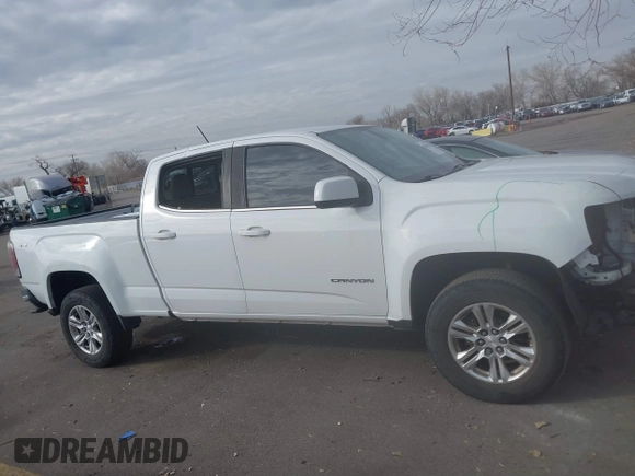 2019 GMC Canyon 4WD SLE z VIN 1GTG6CEN5K1297945, wystawiony jako IAAI lot #41308105 z przebiegiem 93 226 mil mil oraz . Historia ofert i sprzedaży dostępna na DreamBid. Obrazek 13.