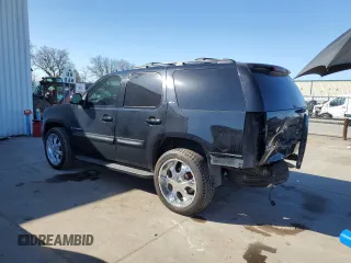 2009 GMC Yukon SLT w/4SB with VIN 1GKFK33059R106202, listed as a Copart auction lot 46700985 with 156,709 mi miles and Salvage Title. Bid and sale history available at carsss.com. Image 2.