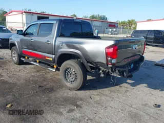 2018 Toyota Tacoma SR5 with VIN 3TMAZ5CN4JM069965, listed as a IAAI auction lot 41798238 with 124,619 mi miles and . Bid and sale history available at DreamBid. Image 3.