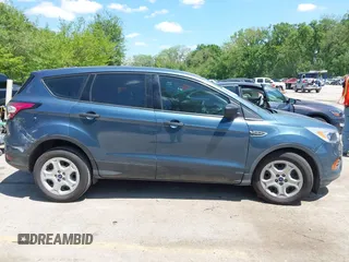 2018 Ford Escape S z VIN 1FMCU0F79JUA63979, wystawiony jako IAAI lot #42184819 z przebiegiem 125 720 mil mil oraz . Historia ofert i sprzedaży dostępna na DreamBid. Obrazek 13.
