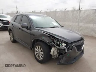 2014 Mazda CX-5 Sport with VIN JM3KE2BE6E0378739, listed as a IAAI auction lot 41840782 with 215,464 mi miles and . Bid and sale history available at DreamBid. Image 1.
