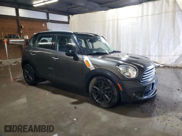 2014 MINI Countryman with VIN WMWZB3C59EWR42124, listed as a Copart auction lot 57830395 with 125,000 mi miles and Salvage title. Bid and sale history available at DreamBid. Image 4.