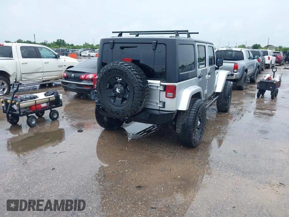 2012 Jeep Wrangler Unlimited Call of Duty MW3 with VIN 1C4BJWFG7CL281844, listed as a IAAI auction lot 42494946 with 93,669 mi miles and . Bid and sale history available at DreamBid. Image 4.