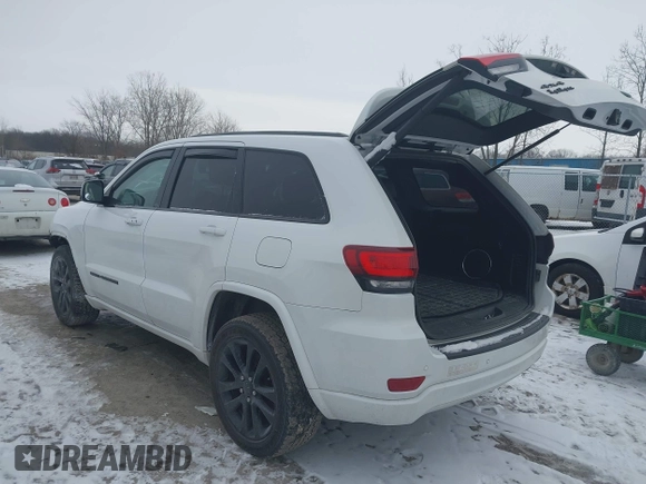 2018 Jeep Grand Cherokee Laredo E with VIN 1C4RJFAG1JC499457, listed as a IAAI auction lot 41379459 with 127,344 mi miles and . Bid and sale history available at DreamBid. Image 3.