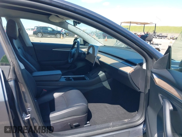 2022 Tesla Model 3 with VIN 5YJ3E1EA6NF144098, listed as a IAAI auction lot 41965360 with 75,597 mi miles. Bid and sale history available at carsss.com. Image 5.