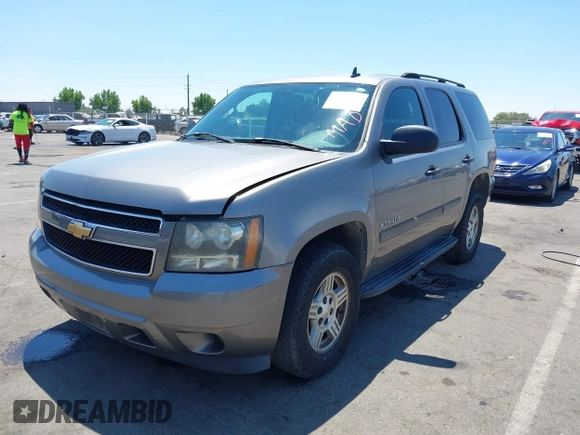 2007 Chevrolet Tahoe LT with VIN 1GNFC13J87R242057, listed as a IAAI auction lot 42736911 with 162,569 mi miles and . Bid and sale history available at DreamBid. Image 2.