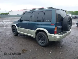 1997 Suzuki Sidekick z VIN JS3TD21V7V4109189, wystawiony jako IAAI lot #42526480 z przebiegiem 133 248 mil mil oraz . Historia ofert i sprzedaży dostępna na DreamBid. Obrazek 3.