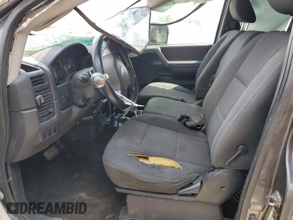 2012 Nissan Titan S z VIN 1N6AA0CJ9CN325160, wystawiony jako Copart lot #70004034 z przebiegiem 167 159 mil mil oraz Szkoda całkowita • Salvage title. Historia ofert i sprzedaży dostępna na DreamBid. Obrazek 7.